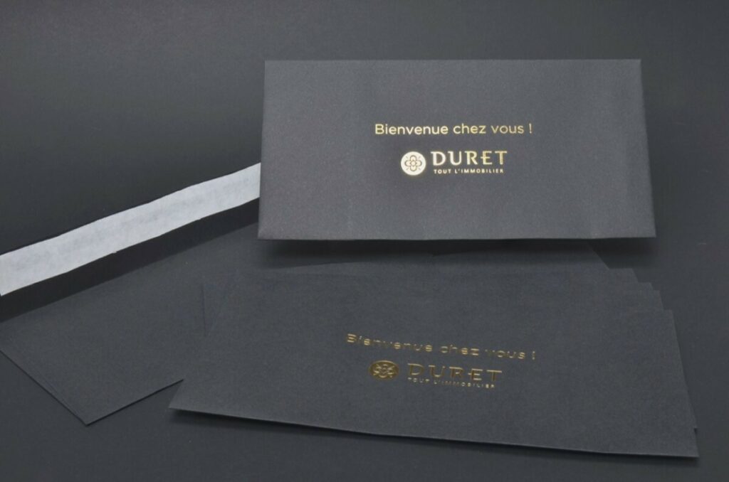 Enveloppes DL Noir avec logo en dorure à chaud OR pour Promoteur immobilier