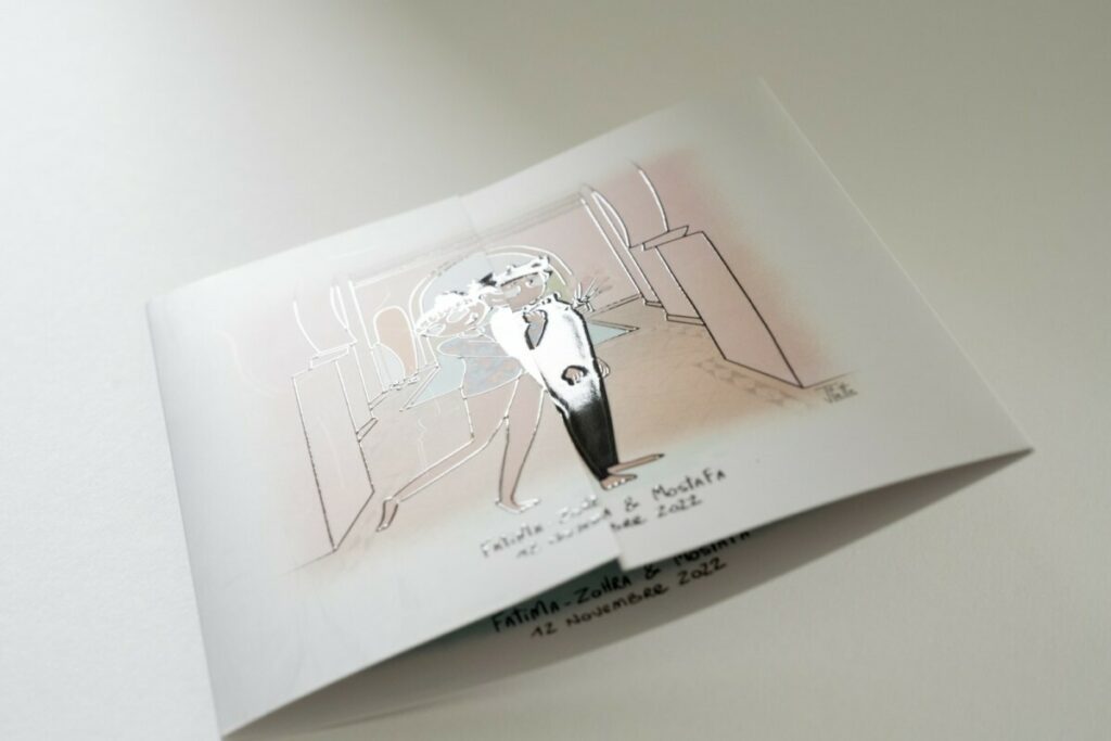 Faire-part de mariage Marrakech en vernis 3D- Rainage et pliage fenêtre – Personnages dessin aquarelle – Pelliculage Mat